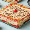 Fruit Trifle Recipe for Eid with layers of sponge cake custard fresh fruits and whipped cream by Ambas Foods